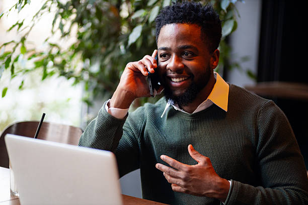 istock Young man having phone call in cafe 2249766056