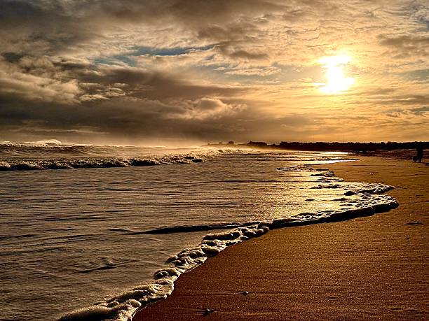 Breaking waves on a beach in Northumberland on a windy day