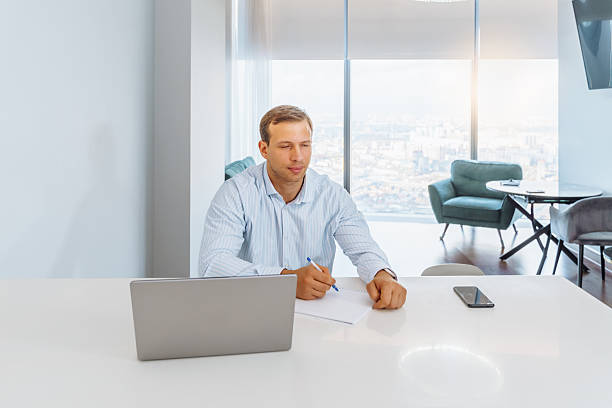 istock Professional conducting a financial audit at a modern office with a city view 2249767311