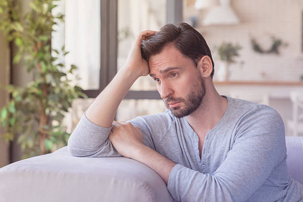 istock Tired stressed sad bored young caucasian man relaxing after work, family relationship problems, emotional stress, depression. Mature man thinking about his difficult life situation. Negative emotions 2249767387