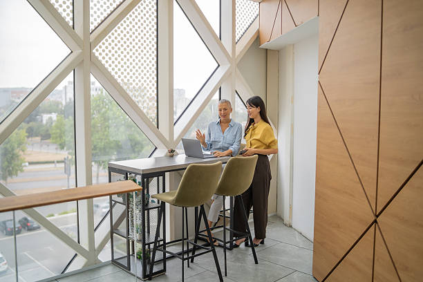 istock Businesswomen working on laptop in modern office 2249768030
