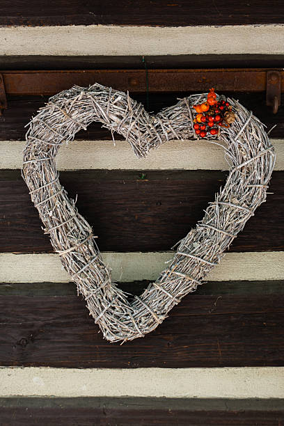 autumn wreath with autumn leaves and black berry. / Heart frame