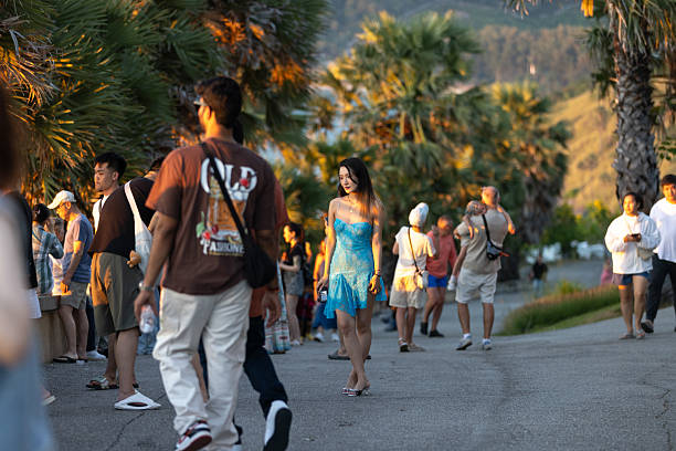 02 December 2025, Phuket Island - Thailand.Tourists gather at the Promthep Cape viewpoint in Phuket as the sun sets over the Andaman Sea. Known as a major tourist landmark, Promthep Cape attracts large numbers of visitors daily due to its panoramic scenery and status as a signature viewpoint of the island.