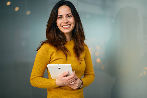 istock Businesswoman holding digital tablet smiling confident in office 2249771705