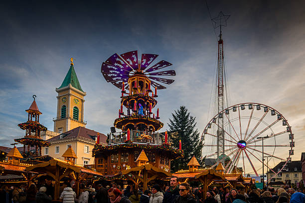 Karlsruhe, Germany - November 29, 2025: Colorful christmas market with many illuminated huts in Karlsruhe.