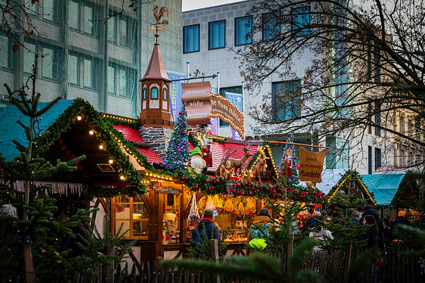 Karlsruhe, Germany - November 29, 2025: Colorful christmas market with many illuminated huts in Karlsruhe.