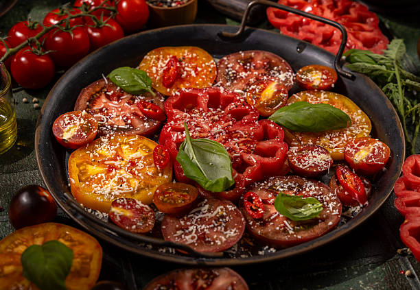 istock Heirloom tomato salad with basil, cheese, and chili 2249781850