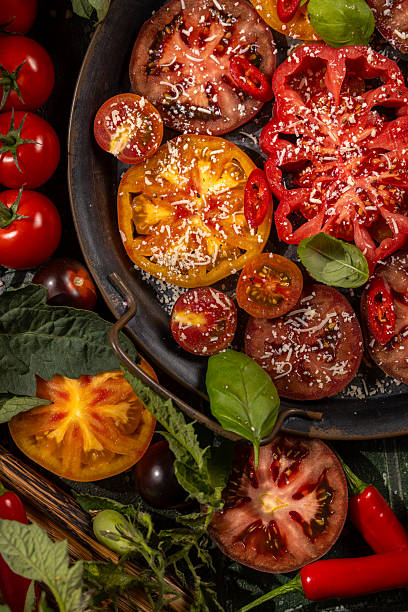 Fresh heirloom tomatoes with basil, chili, and grated parmesan