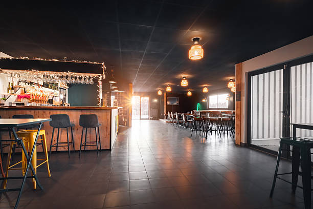 istock Empty craft beer bar interior with wooden counter and stools in cozy modern microbrewery in France 2249785934