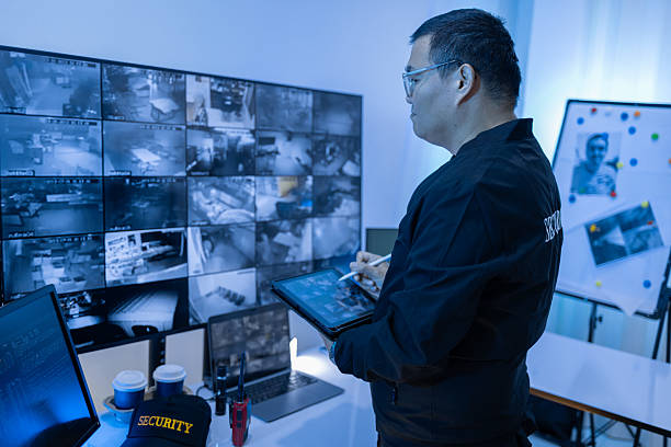 istock Security guard, woman and tablet with surveillance video, observation app and watching at night. Working in Control room by cctv monitor for protection, data center or building safety. Inspection, video surveillance agency and control room with footage 2249789777
