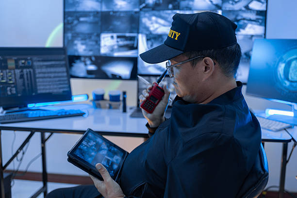 istock Security guard, woman and tablet with surveillance video, observation app and watching at night. Working in Control room by cctv monitor for protection, data center or building safety. Inspection, video surveillance agency and control room with footage 2249789919