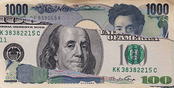 istock Torn Money Combining US Dollar and Yen 2249791871