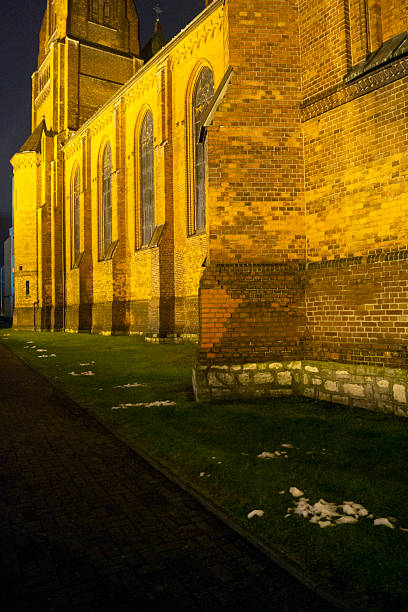 The historic neo-Gothic Church of St. Joachim in Sosnowiec's Zagórze district. Night view of the illuminated building.