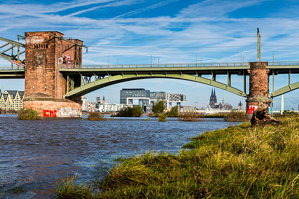 Cologne, Germany - October 13, 2024: bridge over rhine river with view to modern buildings at Rheinauhafen in Cologne in Germany