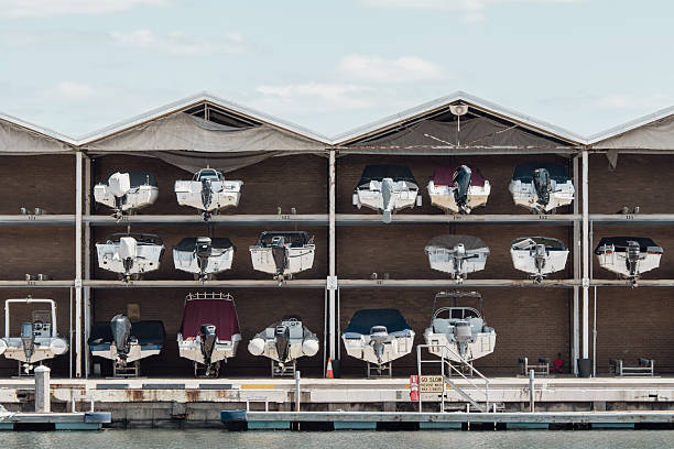 Small motorboats were stacked in a shed in the harbor.