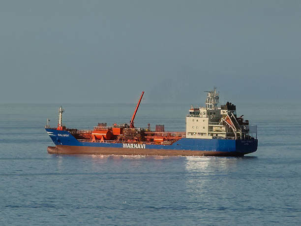 Aerial drone view of an oil tanker at anchor.