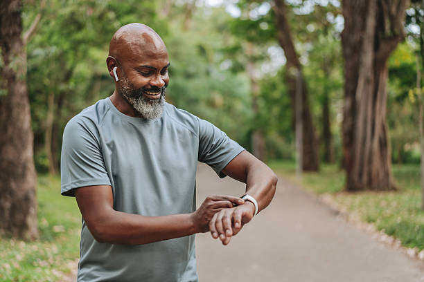 istock Senior man runner looking at smartwatch outdoor activity 2249804032