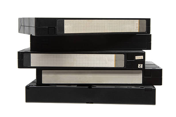 istock A stack of black VHS video tapes with blank labels on a white background. 2249805536