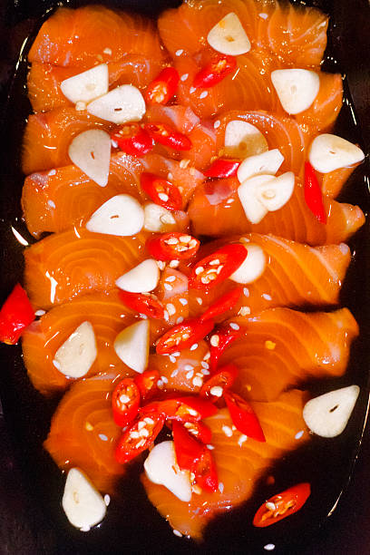 Top view of thai spiced raw salmon with garlic and chili