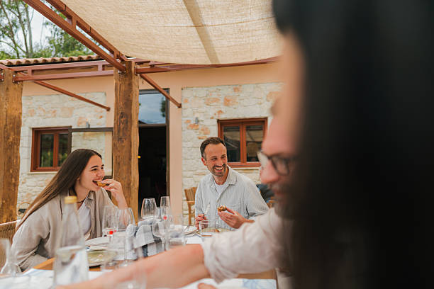istock Happy friends in an outdoor restaurant 2249809893