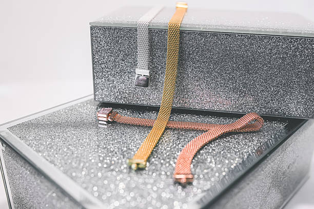 Luxury mesh jewelry bracelets displayed on glitter gift boxes, elegant accessories arranged as a premium present idea in a stylish and modern composition
