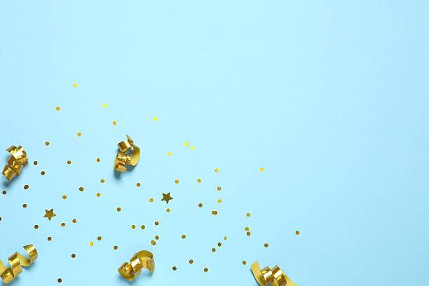 istock Golden confetti on blue background 2249812935