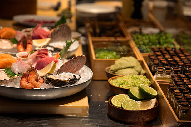 istock Fresh seafood platter with assorted shellfish and garnishes on display 2249813788