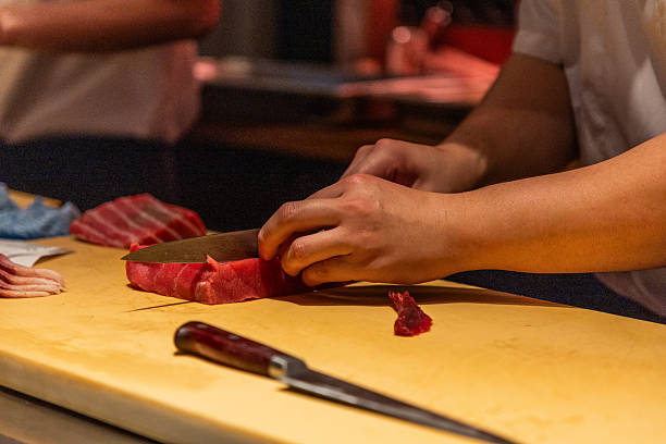 istock Skilled chef preparing fresh sushi with vibrant ingredients on wooden board 2249814021