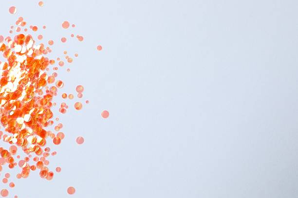 istock Top view of beautiful orange confetti on a white background 2249818601