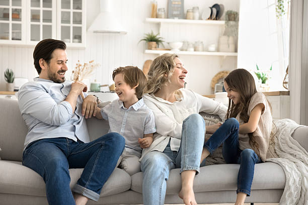 istock Overjoyed mom dad play tickle game with diverse little kids 2249824646