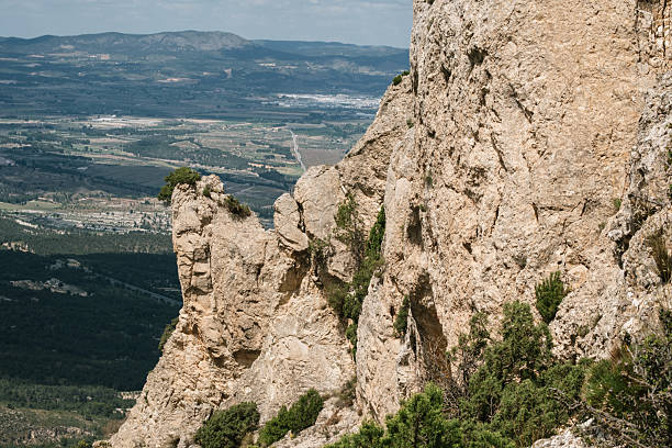 Rugged mountain terrain with panoramic valley views and majestic rocky cliffs.
