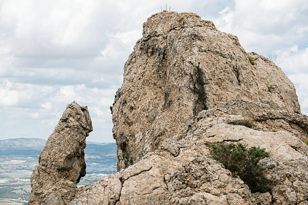 Dramatic rocky mountain landscape with cloudy sky view.