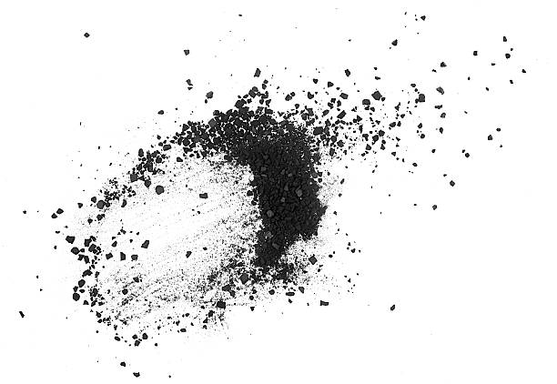 istock Black coal chunks, shattered pieces isolated on a white background, top view. Charcoal powder dust. 2249829489