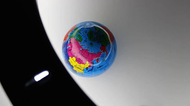 istock Top View of Globe On White Surface Illuminated by Ring Lamp Stock Image for Planet Earth Theme 2249831049