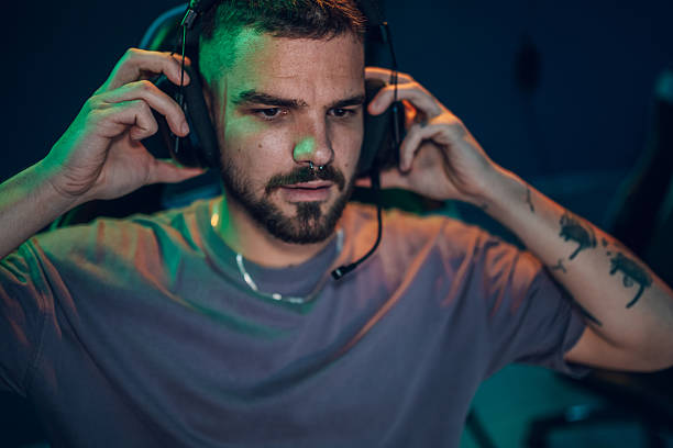 istock Male gamer wearing headset getting ready for online game 2249833145