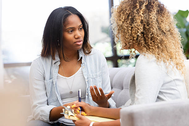 istock Two women engaged in a serious discussion indoors, one taking notes 2249834717