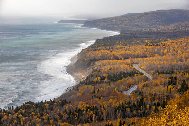 Cabot Trail in Nova Scotia offers breathtaking views with vibrant autumn foliage along its scenic coastal route.