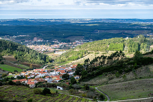 Village rooftops in forested Montejunto valley