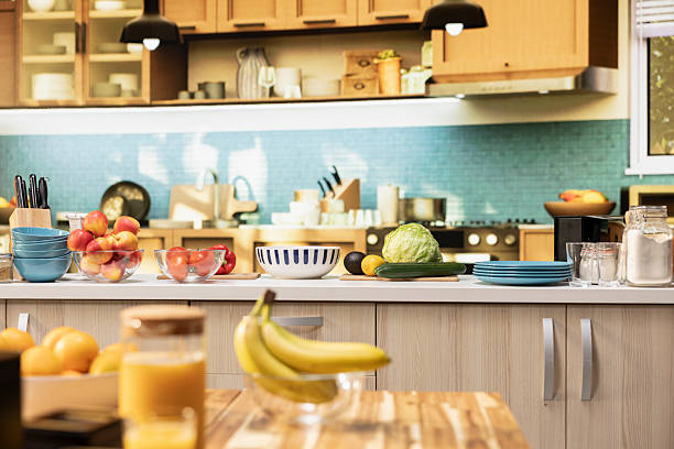 istock Empty kitchen with wooden dining furniture and modern appliances 2249839810