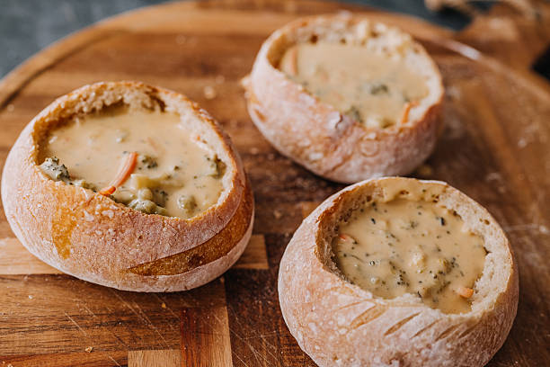 istock Freshly Baked Artisan Bread Bowls with broccoli cheddar soup 2249844050
