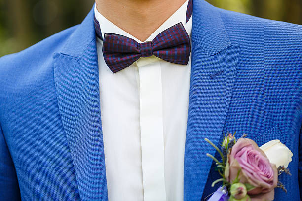 istock man puts on a suit on the wedding day 2249845182