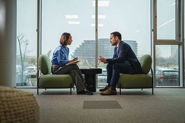 istock Business people discussing during a corporate meeting in modern office 2249853743