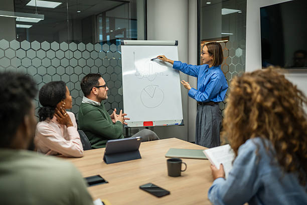 istock Business colleagues discussing data during corporate meeting in office 2249854214