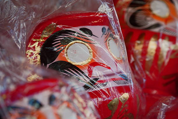 These photos capture the powerful New Year tradition centered around the Daruma Doll in Japan. More than just a souvenir, the Daruma is a deeply meaningful cultural object used for setting goals and manifesting success for the year ahead.The Daruma tradition, which has roots tracing back to China, involves a unique ritual: When people acquire a doll (which range dramatically in size, some taller than an adult!), they fill in the first eye (usually the right) while making a serious wish or goal. The second eye is only filled in when that goal is successfully achieved.These scenes showcase the annual Daruma markets and the dramatic 'burning ceremony' held in the cold winter. At this ceremony, the Daruma dolls from the previous year are reverently burned in a blazing fire, a profound act of purification and spiritual cleansing before starting the new cycle.