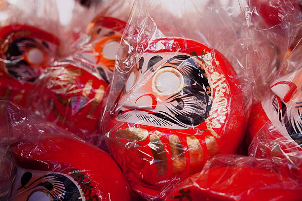 These photos capture the powerful New Year tradition centered around the Daruma Doll in Japan. More than just a souvenir, the Daruma is a deeply meaningful cultural object used for setting goals and manifesting success for the year ahead.The Daruma tradition, which has roots tracing back to China, involves a unique ritual: When people acquire a doll (which range dramatically in size, some taller than an adult!), they fill in the first eye (usually the right) while making a serious wish or goal. The second eye is only filled in when that goal is successfully achieved.These scenes showcase the annual Daruma markets and the dramatic 'burning ceremony' held in the cold winter. At this ceremony, the Daruma dolls from the previous year are reverently burned in a blazing fire, a profound act of purification and spiritual cleansing before starting the new cycle.