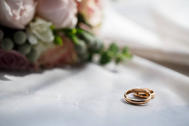 istock Gold wedding rings for newlyweds on wedding day 2249860265
