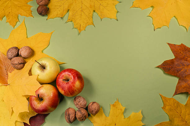 istock Autumn Harvest Composition with Apples, Walnuts, and Maple Leaves 2249860612