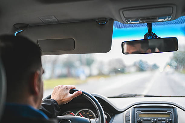istock Man driving car on road during daily commute 2249862988