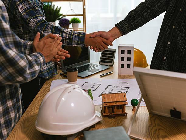 istock Partner and contractor concept of construction team shaking hands greeting new project start plan, project contract in office center at construction site. 2249871254