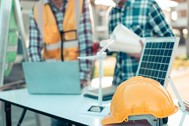 istock Architects and engineers work on blueprints at their desks, designing independently, covering everything from preliminary project sketches, construction drawings, architectural designs. 2249871269